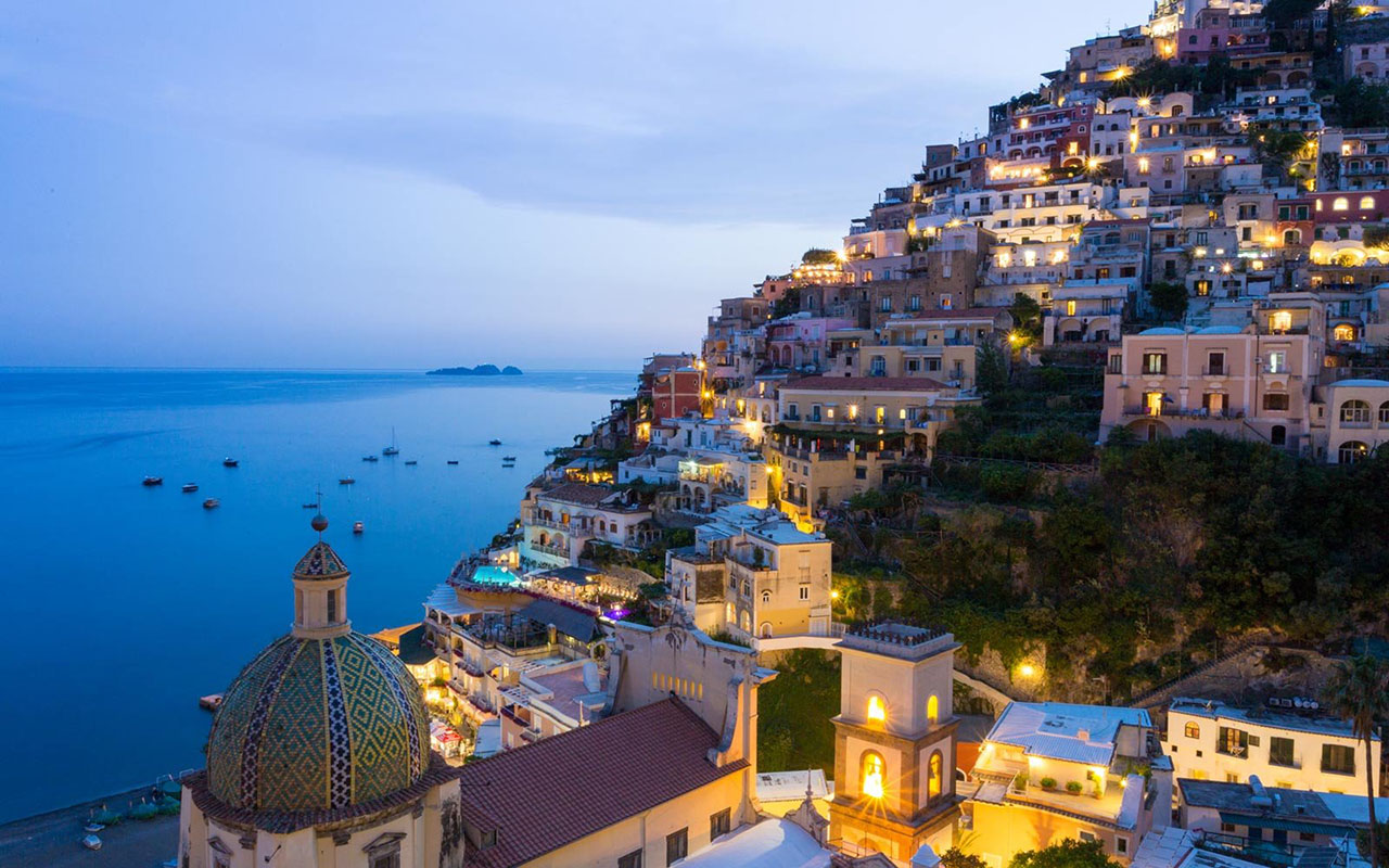 Blue Hour at Positano, Amalfi Coast, Italy. Lights on and a beautiful romantic atmosphere.
